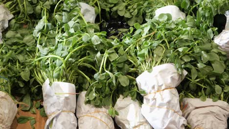 fresh purslane bundles at market