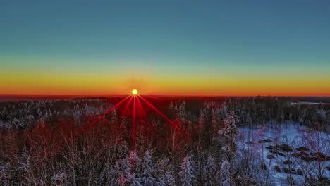 Colorful-sunset-to-nightfall-time-lapse-over-a-winter-forest