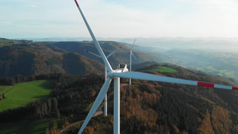 Three-wind-turbines-on-the-mountain-top-of-the-Black-Forest-scenic-steady-shot-in-4k