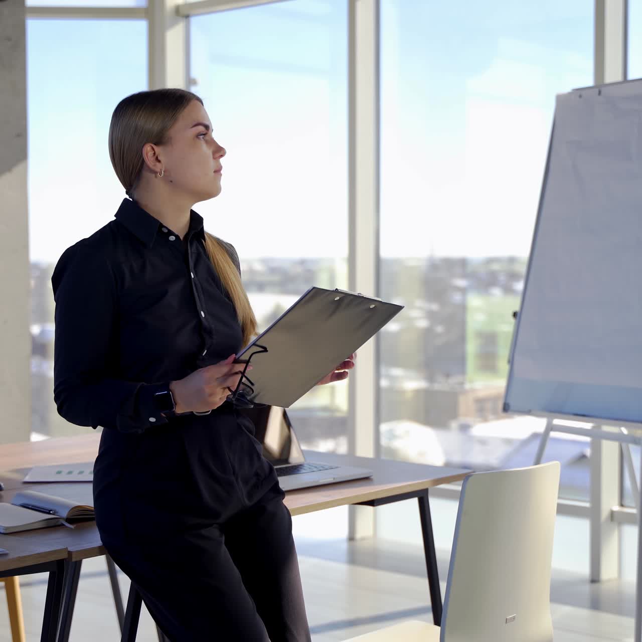 Young business woman thinking about new project