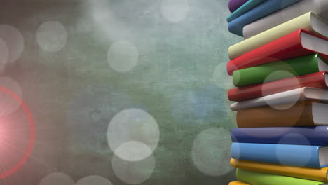 animación de puntos de luz sobre libros sobre fondo verde