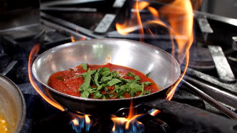 chef podomoro tomatoes sauce in restaurant, close-up, mediterranean