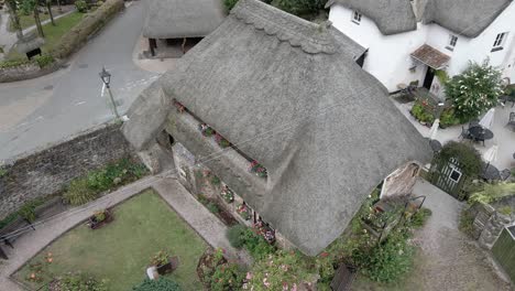 Rustic-old-fashioned-Cockingham-thatched-cottages-picturesque-tourism-village-aerial-rooftop-shot