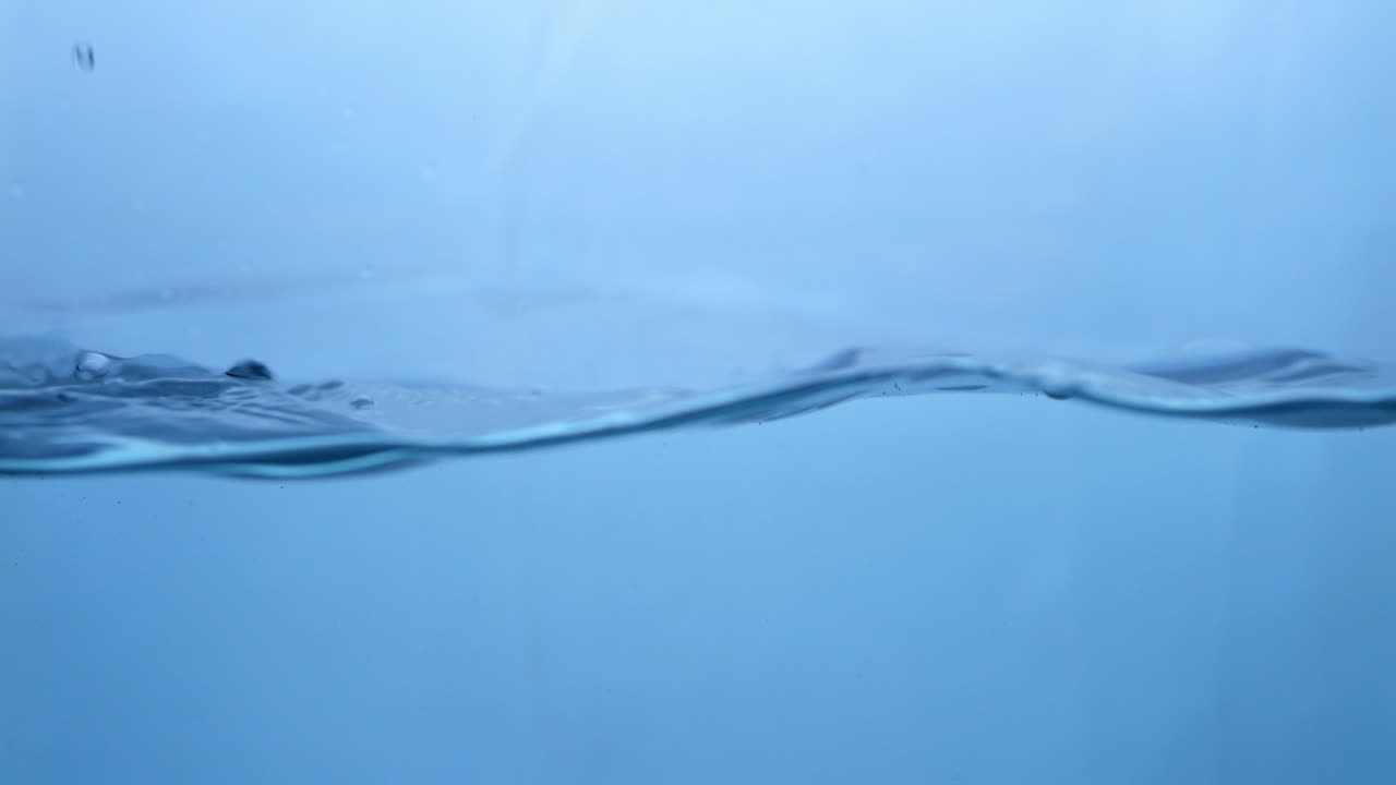 Fluid Dynamics Macro View of Fresh Water Droplets in Motion