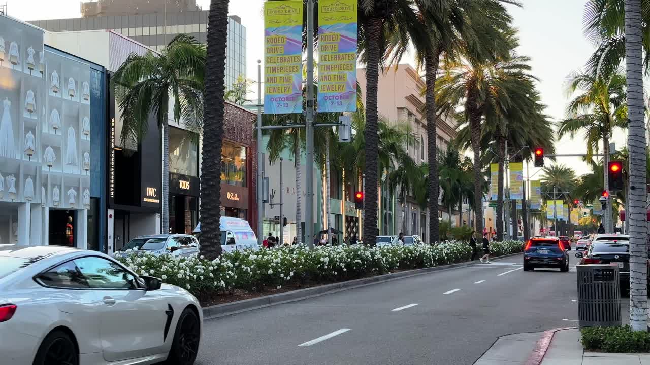 Luxury Cars Driving On Rodeo Drive In Beverly Hills, Los Angeles. Static Slow Motion Shot.