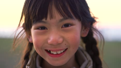 asian girl child, face and park with smile