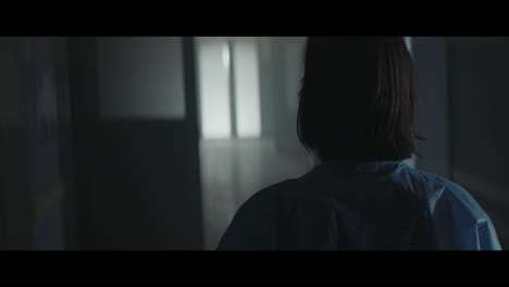 a girl runs through strange corridors of abandoned hospital