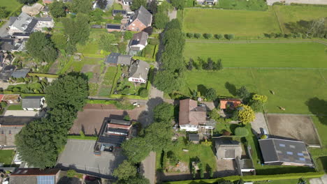 descending aerial of calm street in a beautiful, wealthy neighborhood