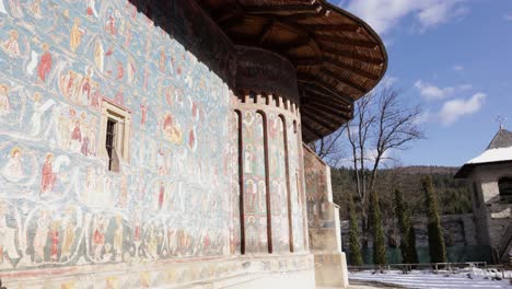 historic painted church at the voronet monastery in northern moldavia, romania