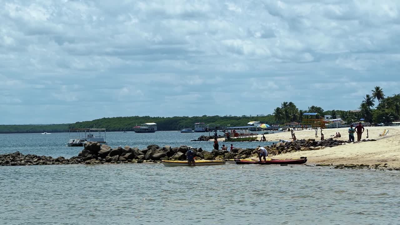 Slow motion shot of the tropical tourist destination Barra de Cunhau beach in the small coastal city of Canguaretama in the state of Rio Grande do Norte, Brazil