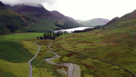 the honister pass looking towards buttermere lake from a drone