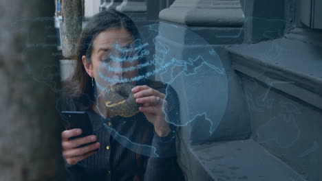 using smartphone, woman with holographic globe and data animation over her