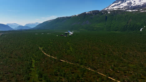 Aerial-view-approaching-the-EISCAT-Troms-station,-sunny,-summer-day-in-Norway