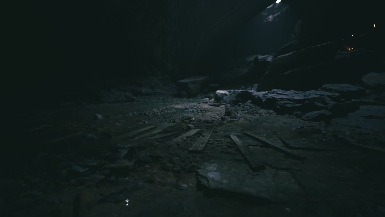 Mysterious underground cave with dim lighting revealing rocky terrain
