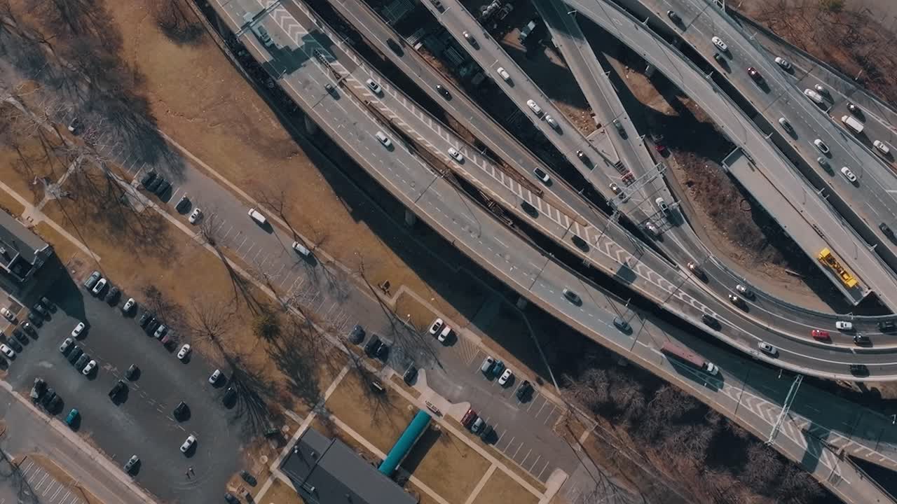 Traffic flows on highways with cars in New York during daytime