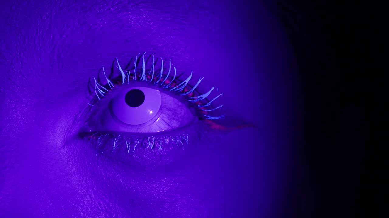 Halloween concept. Demon devil woman with red face and small horns on black background Ideas for halloween body art, make up artist.