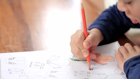 child learning at home sitting at a table stock footage