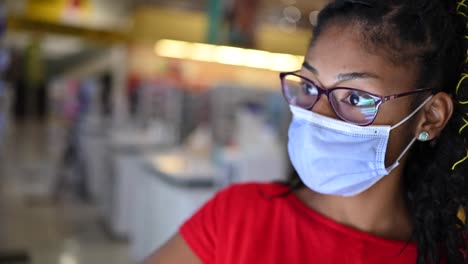 Latin-young-woman-wearing-a-face-mask-shopping-make-up