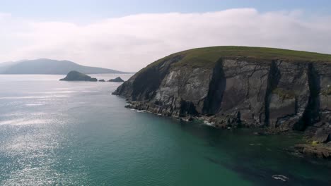 a drone shot of the rugged coastal terrain of the dingle peninsula, near dingle point, in ireland