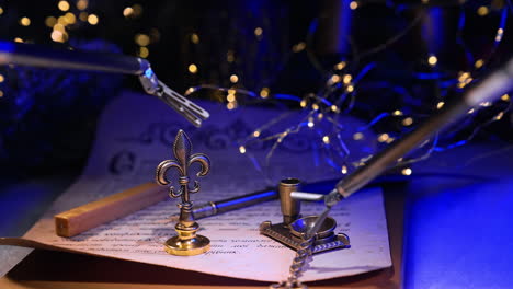 precise moves of the robotic arms. tiny forceps take metal writing appliances lying on the letter. blurred dark backdrop with lights.