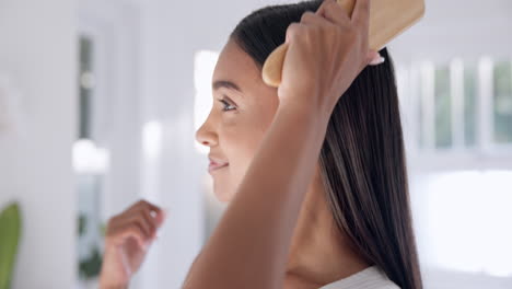 woman, brush hair and haircare in bathroom