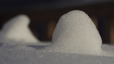 macro shot of frozen snow and ice sparkling in sunlight, extreme cold winter freeze