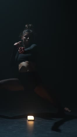 contemporary dance performance in dark studio