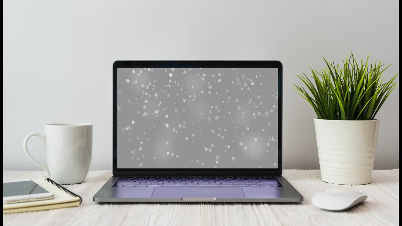 4k video computer laptop show bokeh blinking views for social marketing and business uses on wooden desk with a little tree decoration in modern office workplace.