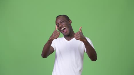 young happy african man smiling while giving thumbs up