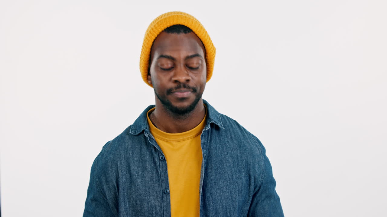 Heart, hands and face of black man in studio