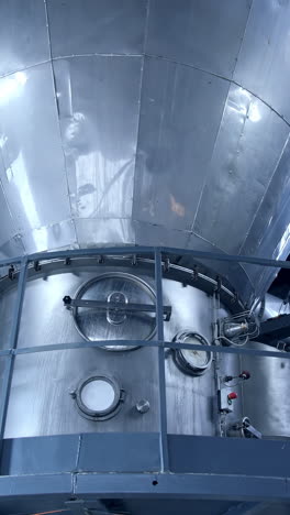 large milk processing plant. modern metal equipment inside the factory for production of dairy products. dairy food production plant.. vertical video