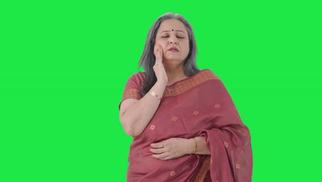 Sick-Indian-old-woman-suffering-from-tooth-pain-Green-screen