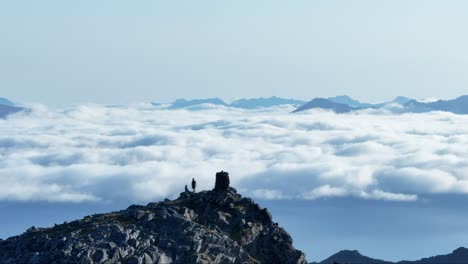 aerial view of people on the mountain peak of lonketinden in senja island, northern norway