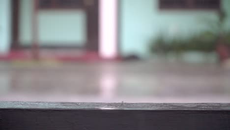 heavy rainfall on the house fence. rainy season