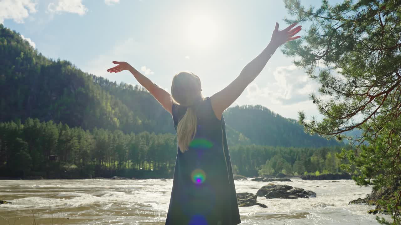 Woman enjoying nature by a river