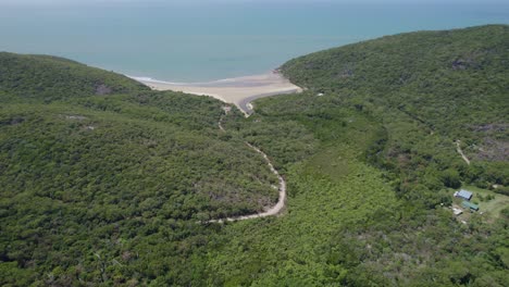 aerial view of finch bay beach and road in summer in cooktown, north queensland, australia