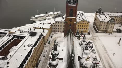 smooth cinematic aerial footage of drone flying over famous tourist attraction, the riddarholmen church in the city centre of stockholm