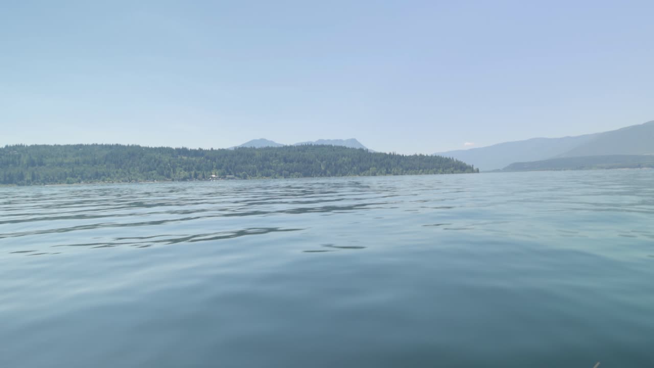 Boating on the beautiful scenic waters of lake Shuswap near Salmon Arm British Columbia, Canada