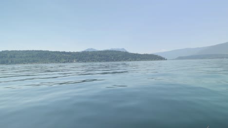 boating on the beautiful scenic waters of lake shuswap near salmon arm british columbia, canada
