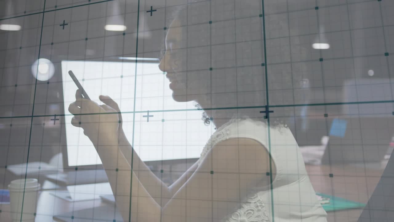 Office user reaching smartphone and dictating text at desk, transparent grid guiding UI navigation