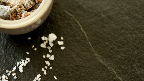 mortar and pestle with black salt 4k