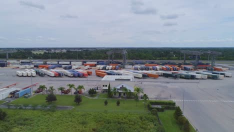 4K-Drone-Video-of-Trains-and-Trucks-at-CSX-Intermodal-Train-Yard-in-Winter-Haven,-FL