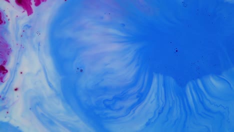 abstract swirls of blue and pink paint