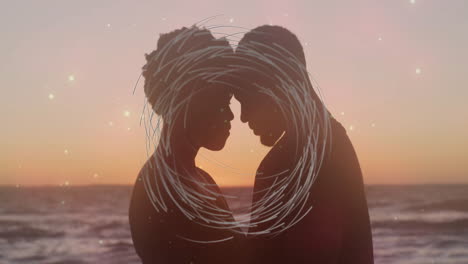 silhouetted couple embracing at sunset with swirling light animation overlay