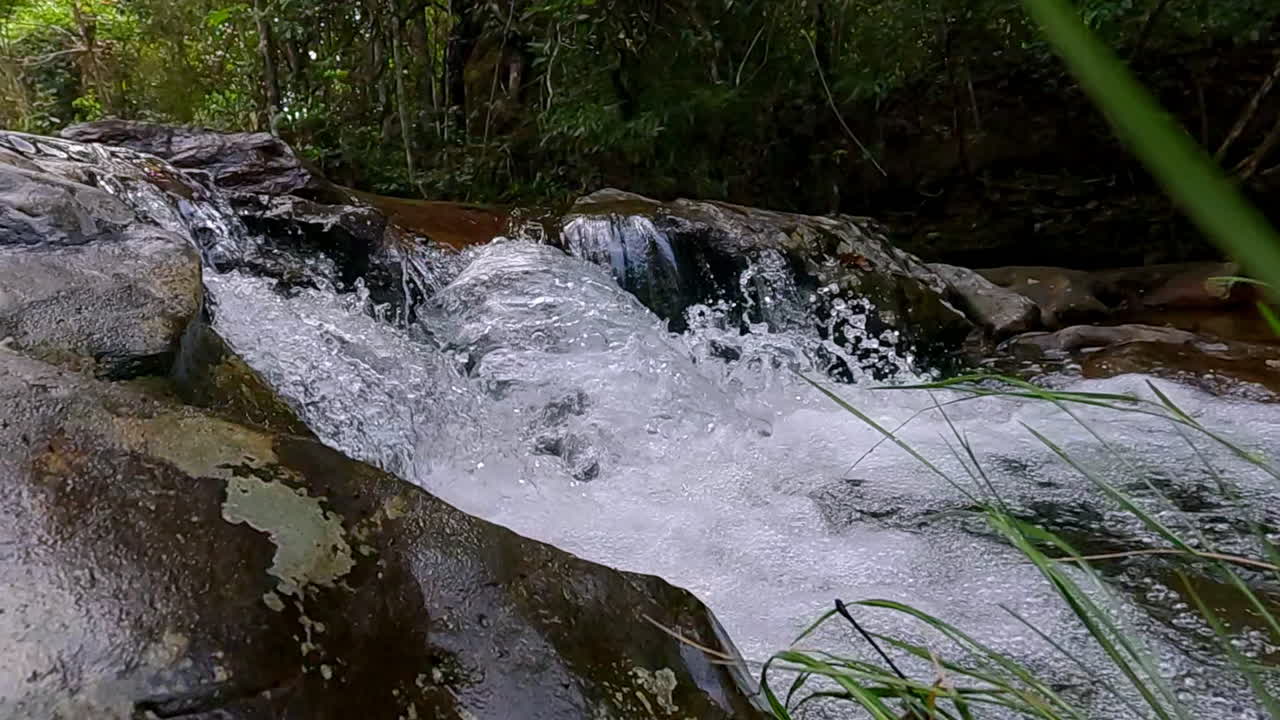 Serene nature sounds, powerful sprays, dynamic water flow, slow motion
