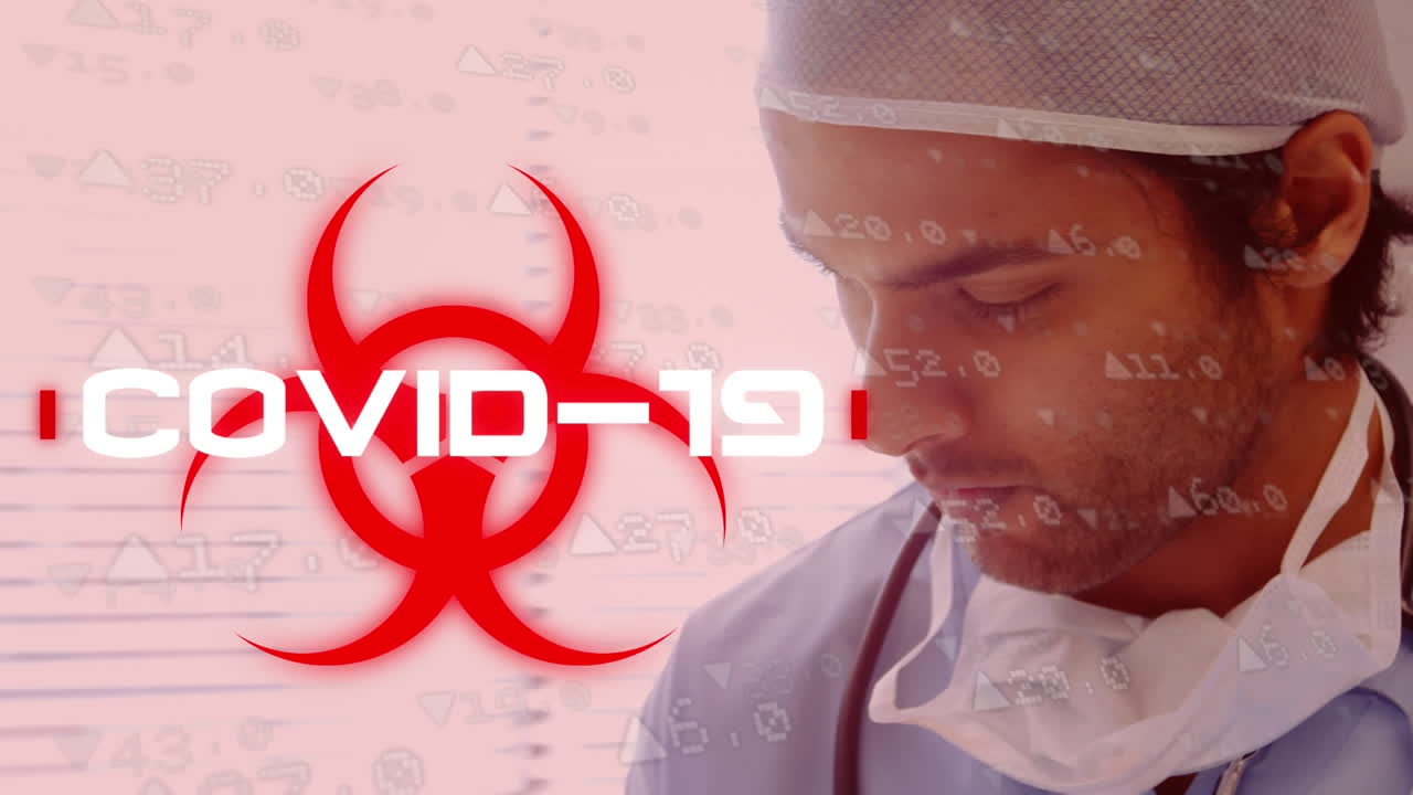 Word Covid-19 written over health hazard sign with a doctor wearing a face mask in background