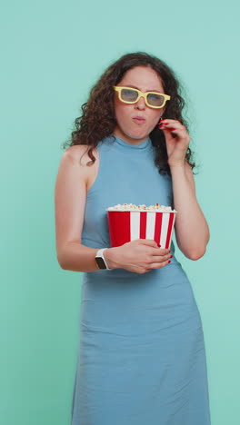 woman in 3d glasses eating popcorn and watching interesting tv serial sport game film online movie