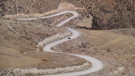 incredible mountain road passing through a valley exiting the mountain pass