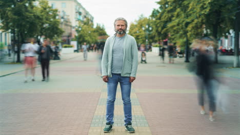 man standing on a city street