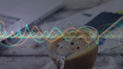 glass coffee cup floating on wooden tabletop while colorful waveform looping across background